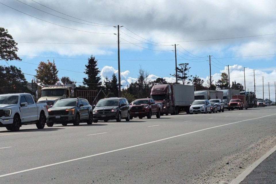 Traffic is backing up as Highway 11 north is closed.